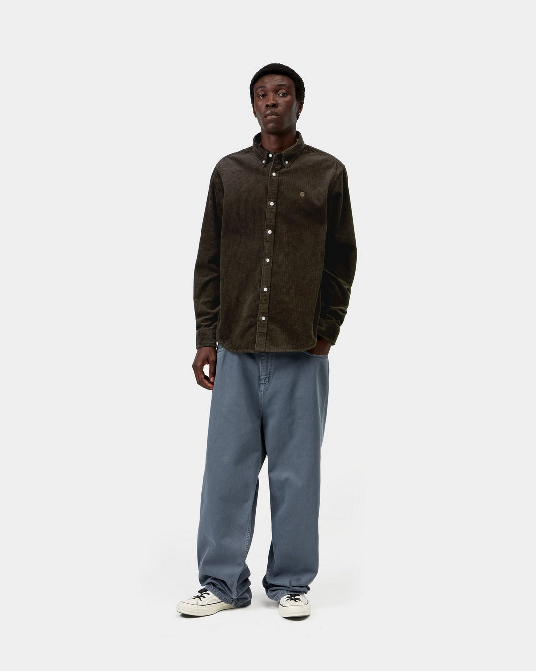 Carhartt WIP L/S Madison Cord Shirt in Tobacco, shown worn by model in front view with button-down collar and chest logo visible.