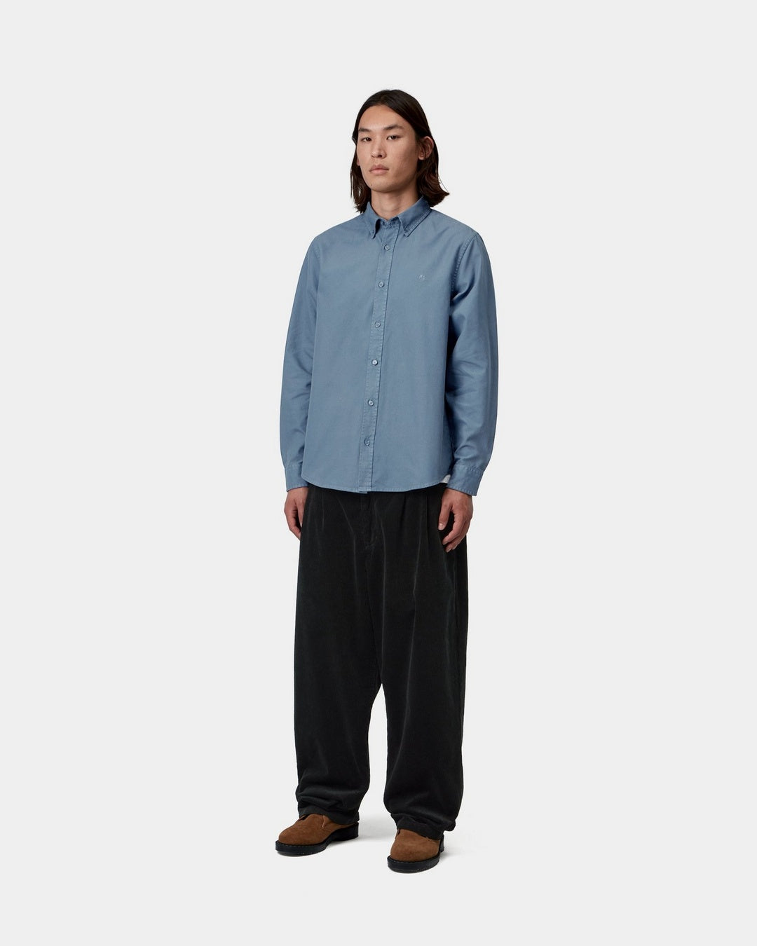 Carhartt WIP L/S Bolton Shirt in Icesheet, worn by model in front view with button-down collar and chest logo visible.