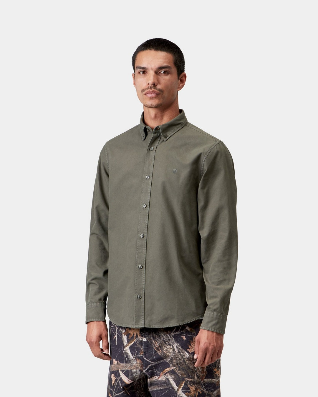 Carhartt WIP L/S Bolton Shirt in Shungite, shown front view with button-down collar and long sleeves, shown on model.