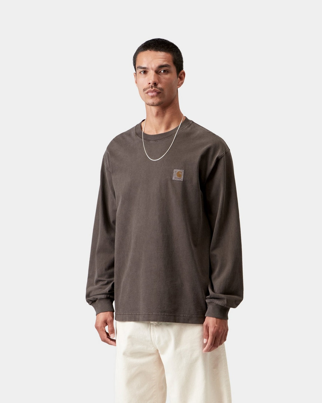 Carhartt WIP L/S Vista T-Shirt in Tobacco, shown front view with a small chest logo patch and long sleeves, shown on model.