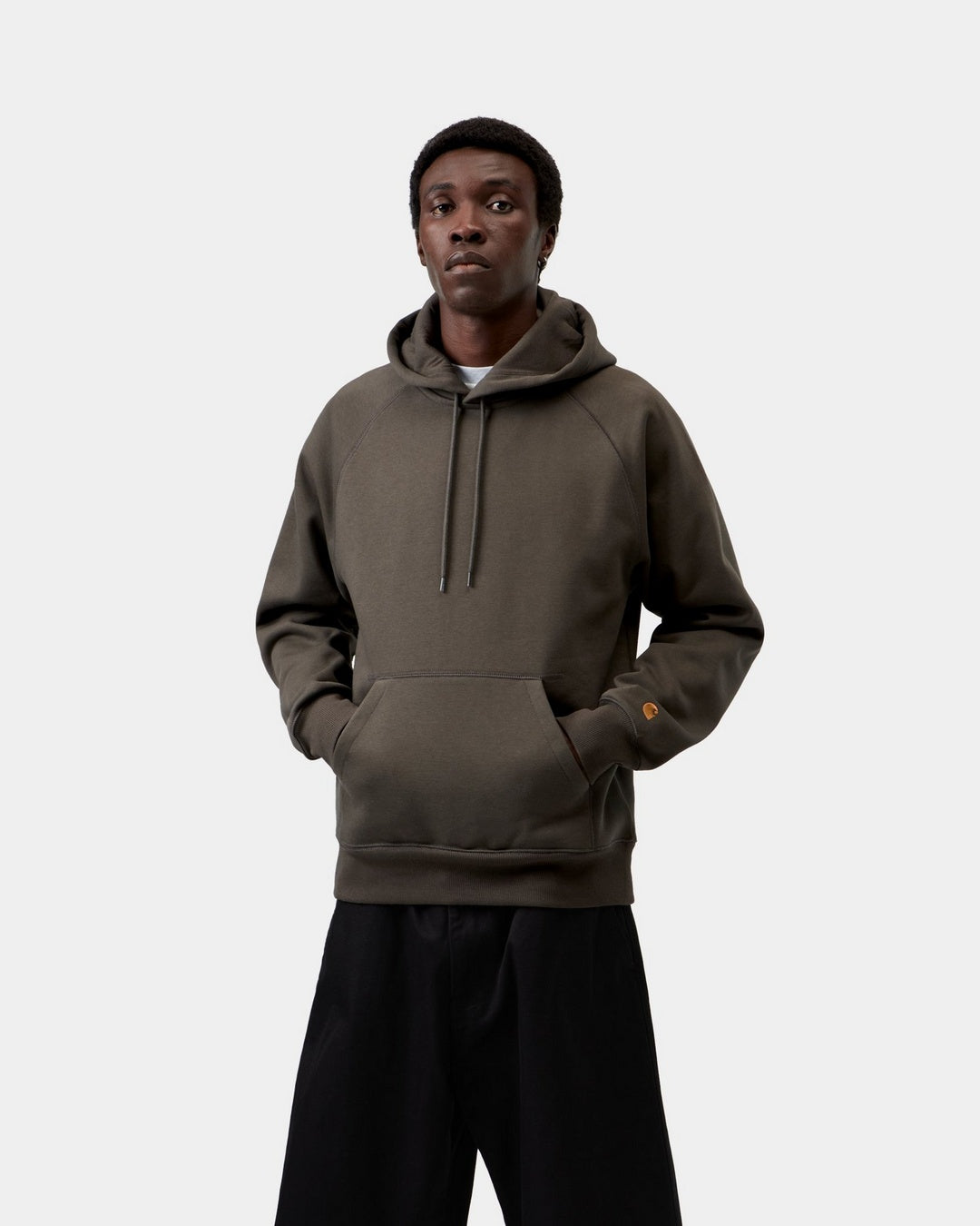 Carhartt WIP Hooded Chase Sweatshirt in Shungite / Gold, front view, with kangaroo pocket and hood drawcords.