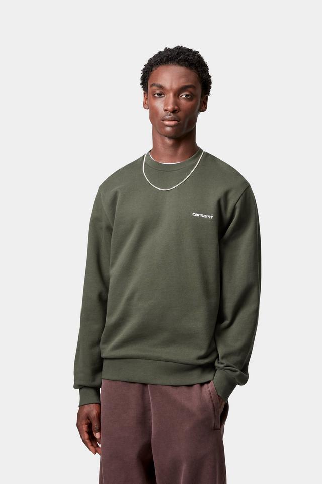 Person wearing a green sweatshirt with a brand logo on a white background