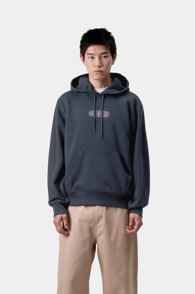 Person wearing a dark blue hoodie with a logo on a white background