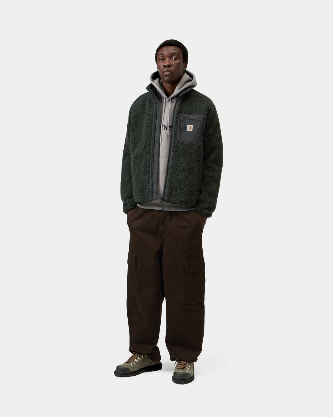 Carhartt WIP Prentis Liner jacket in Raven / Black, shown worn open with a front view, funnel neck, chest pocket and Square Label.