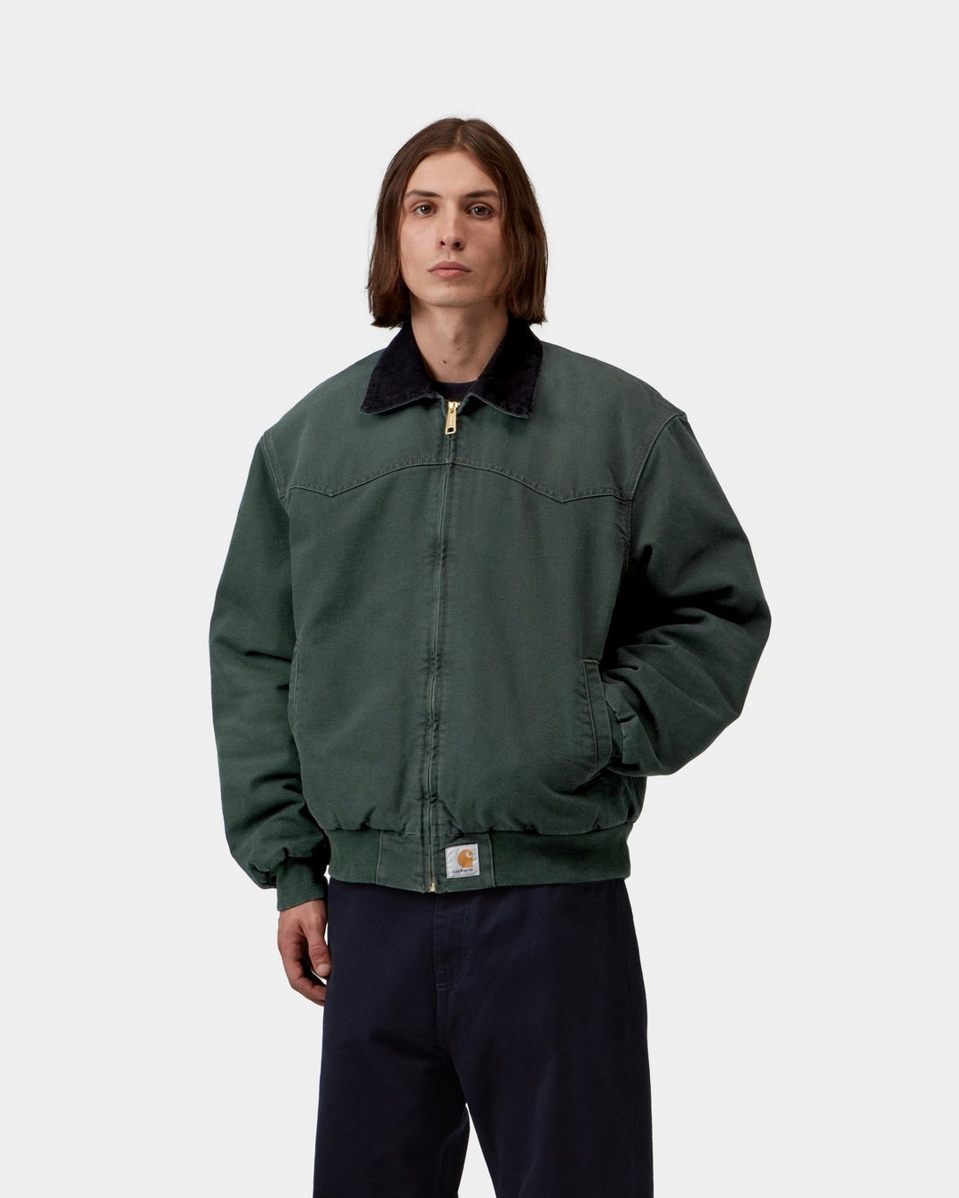 Carhartt WIP OG Santa Fe Jacket in Raven / Black, front view on a model with black corduroy collar, zip front, and Square Label at the hem.