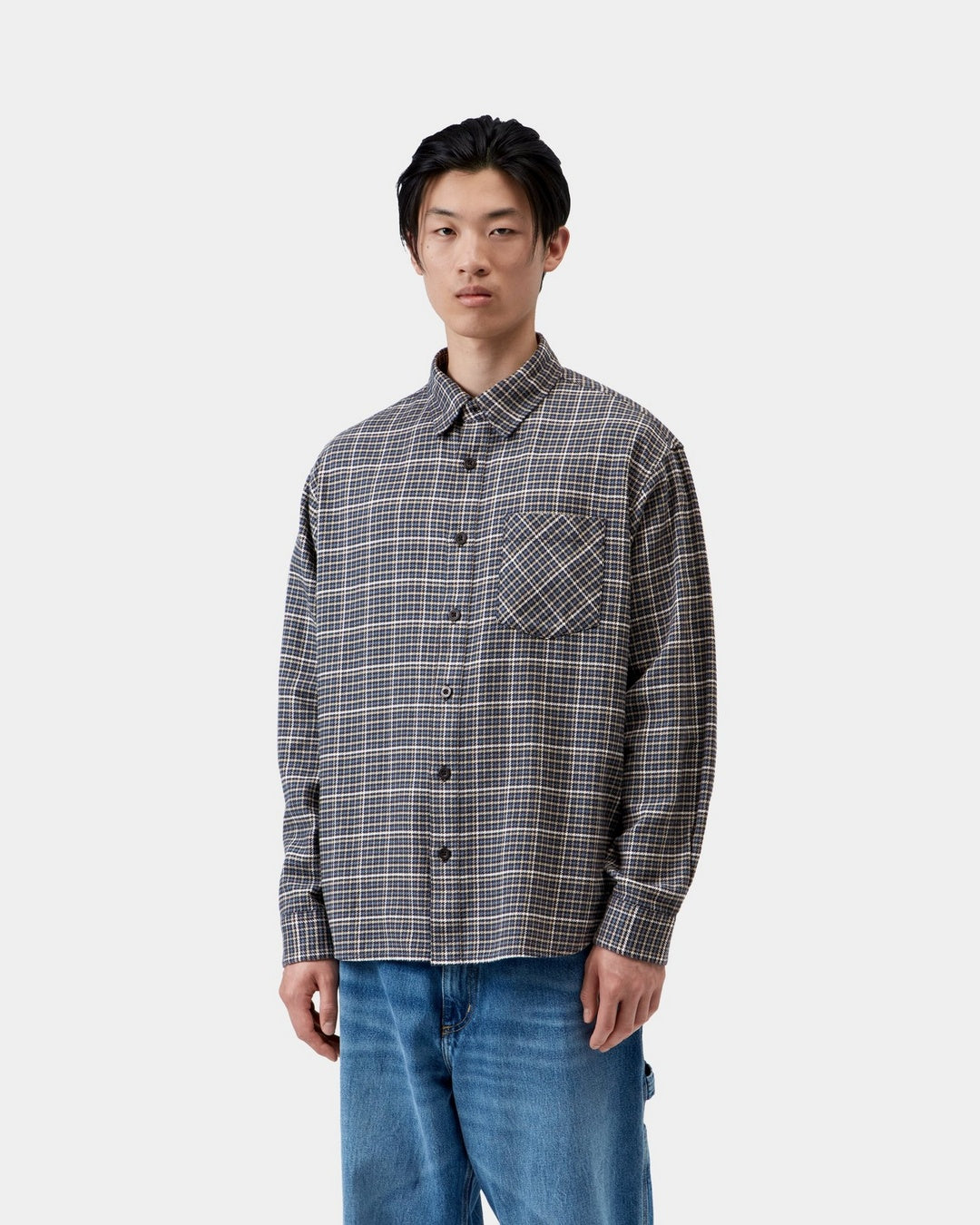 Carhartt WIP L/S Todrick Shirt in Todrick Houndstooth, Icesheet, shown front view with button closure, chest pocket and long sleeves, shown on model.