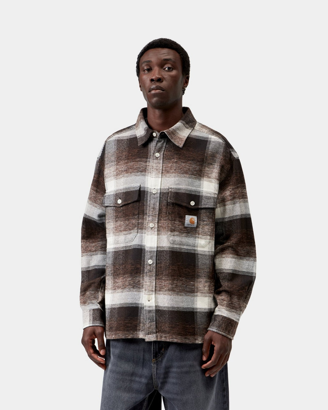 Carhartt WIP L/S Esterson Shirt in Esterson Check, Tobacco, shown front view with allover check, button front, two chest flap pockets, and Square Label, shown on model.