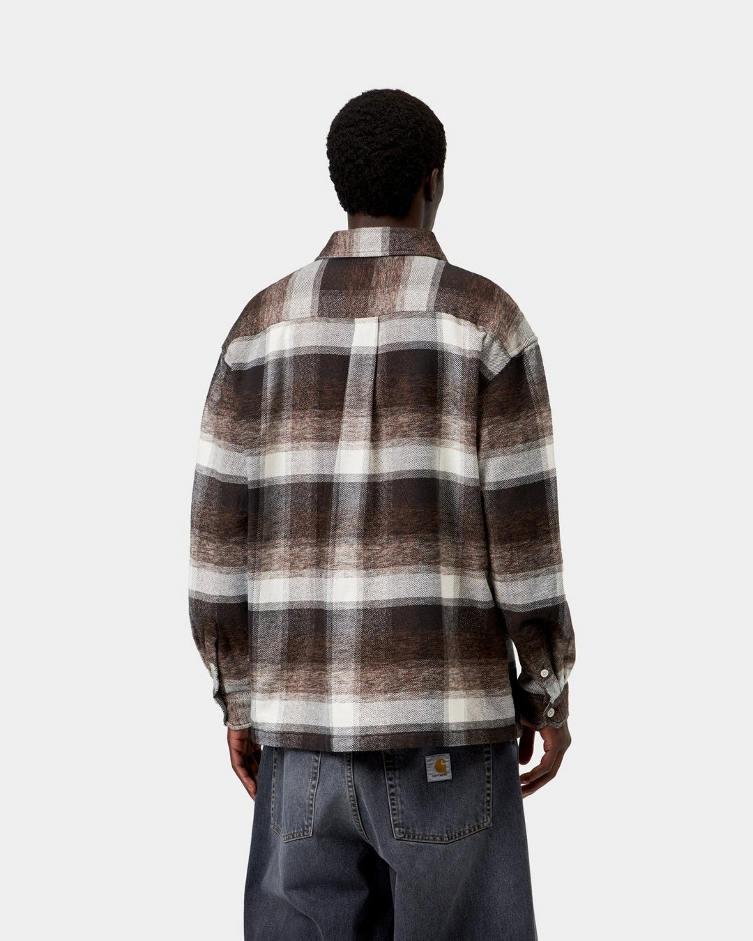 Carhartt WIP L/S Esterson Shirt in Esterson Check, Tobacco, shown from the back with an allover check pattern and woven Square Label at the hem, shown on model.