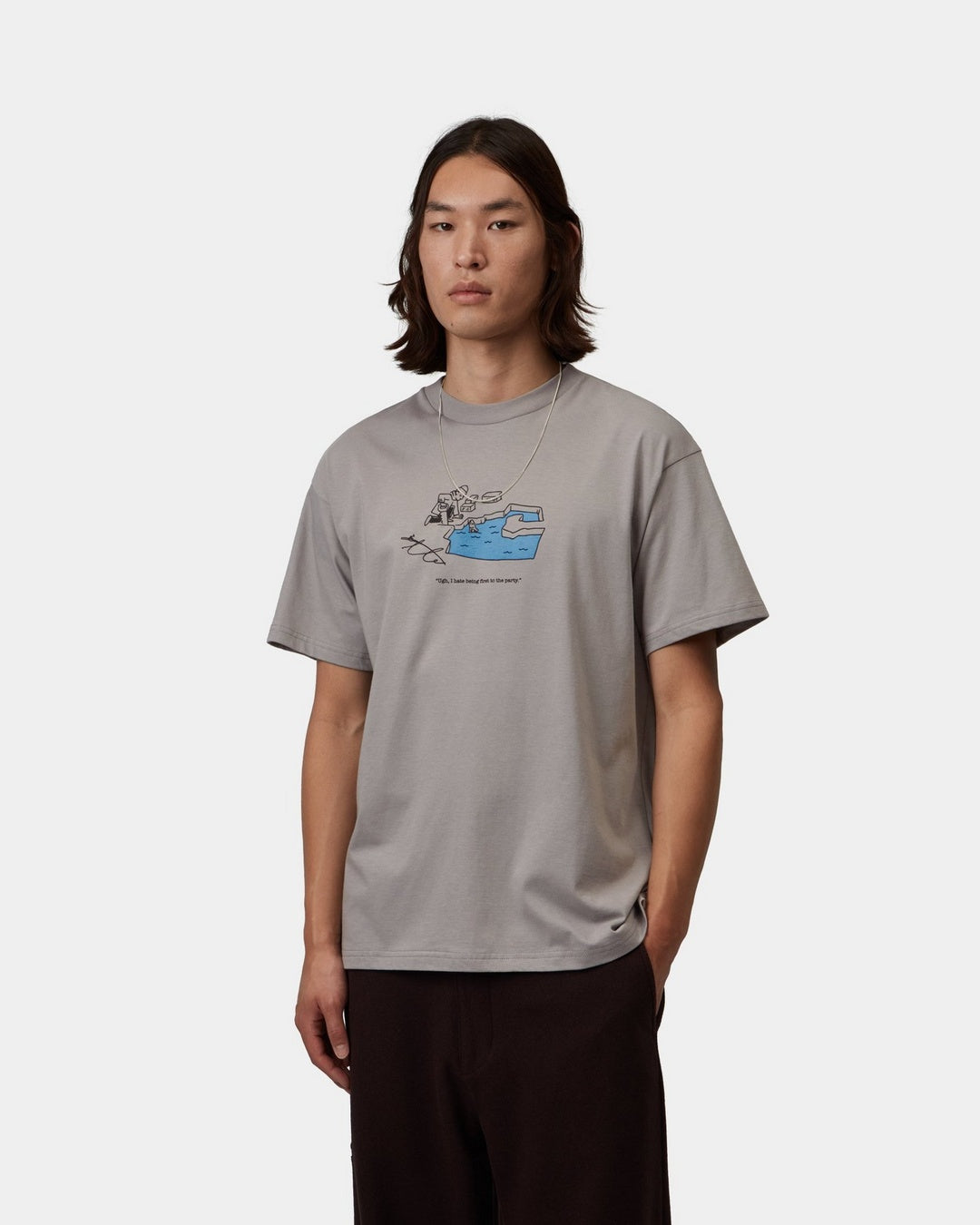 Carhartt WIP S/S Ice Fishing T-Shirt in Shady Grey, front view with graphic print on the chest, shown on model.