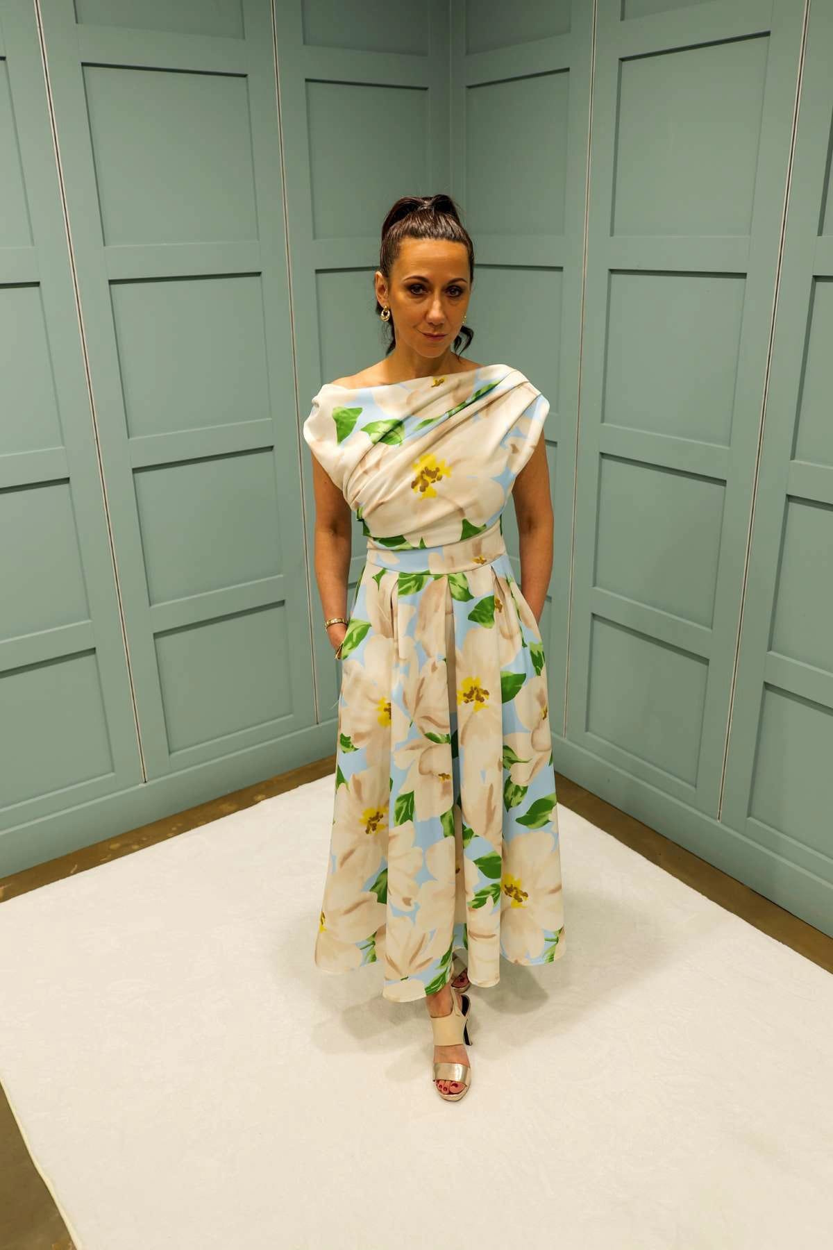 Front view of Betty blue floral midi dress with asymmetric neckline