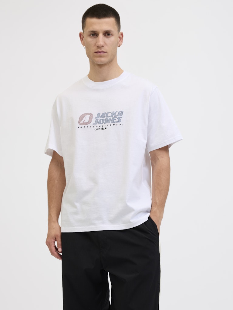 Man wearing a white t-shirt with a logo on a white background