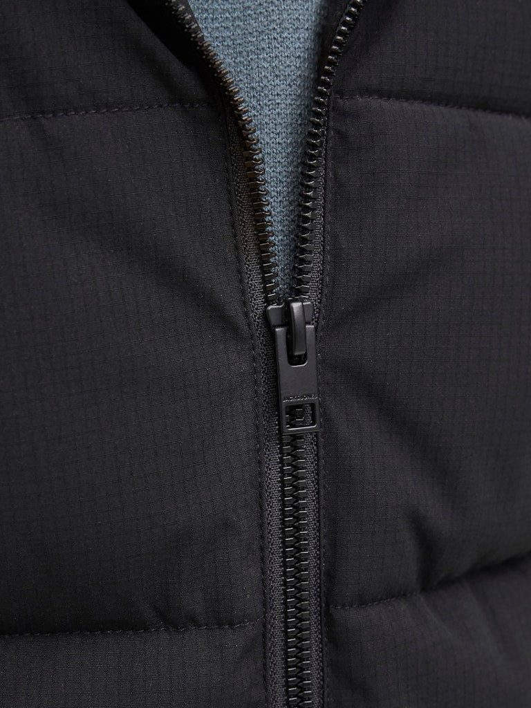 Close-up of a black puffer jacket zipper