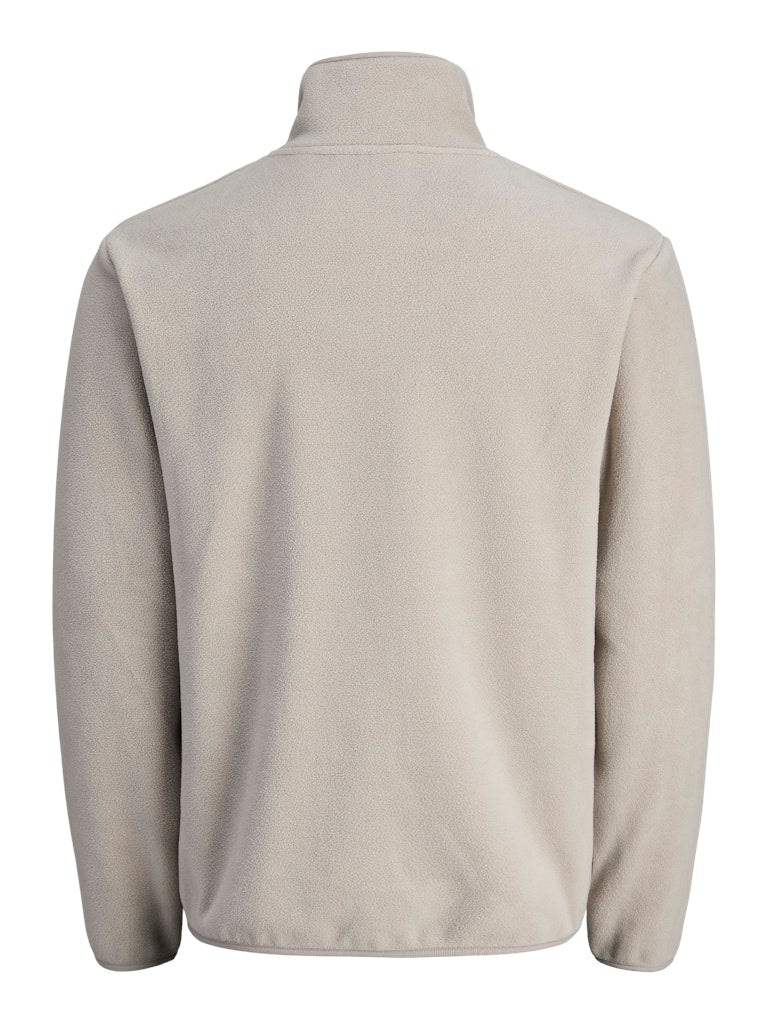 Beige fleece jacket on a white background