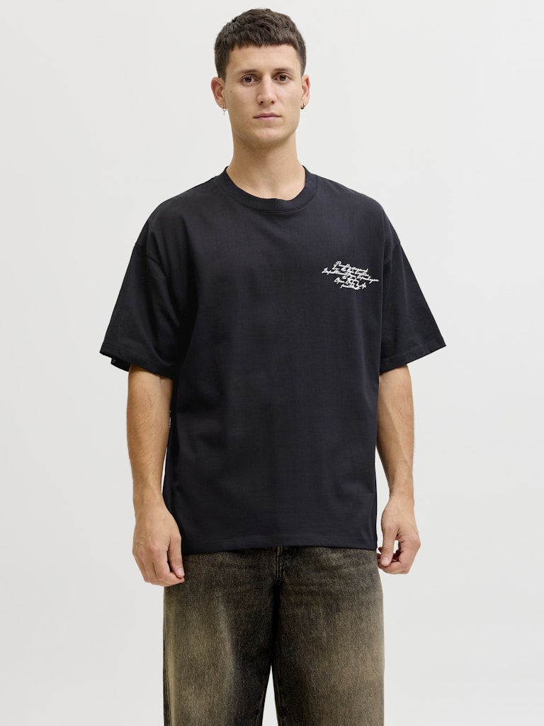 Person wearing a black t-shirt with a logo on a white background