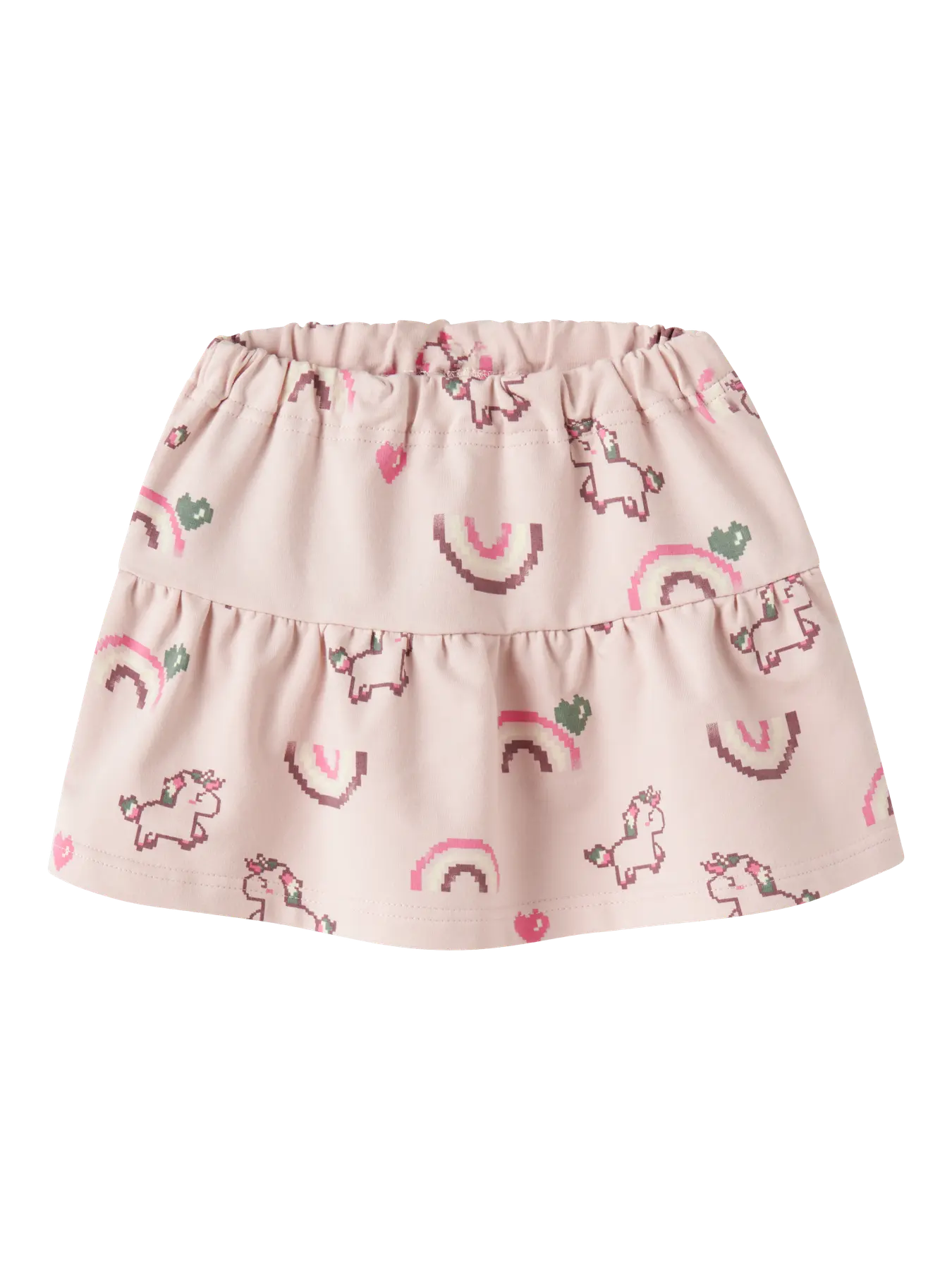 A light pink tiered baby skirt with an all-over print of unicorns, rainbows, and hearts in darker pink and green.