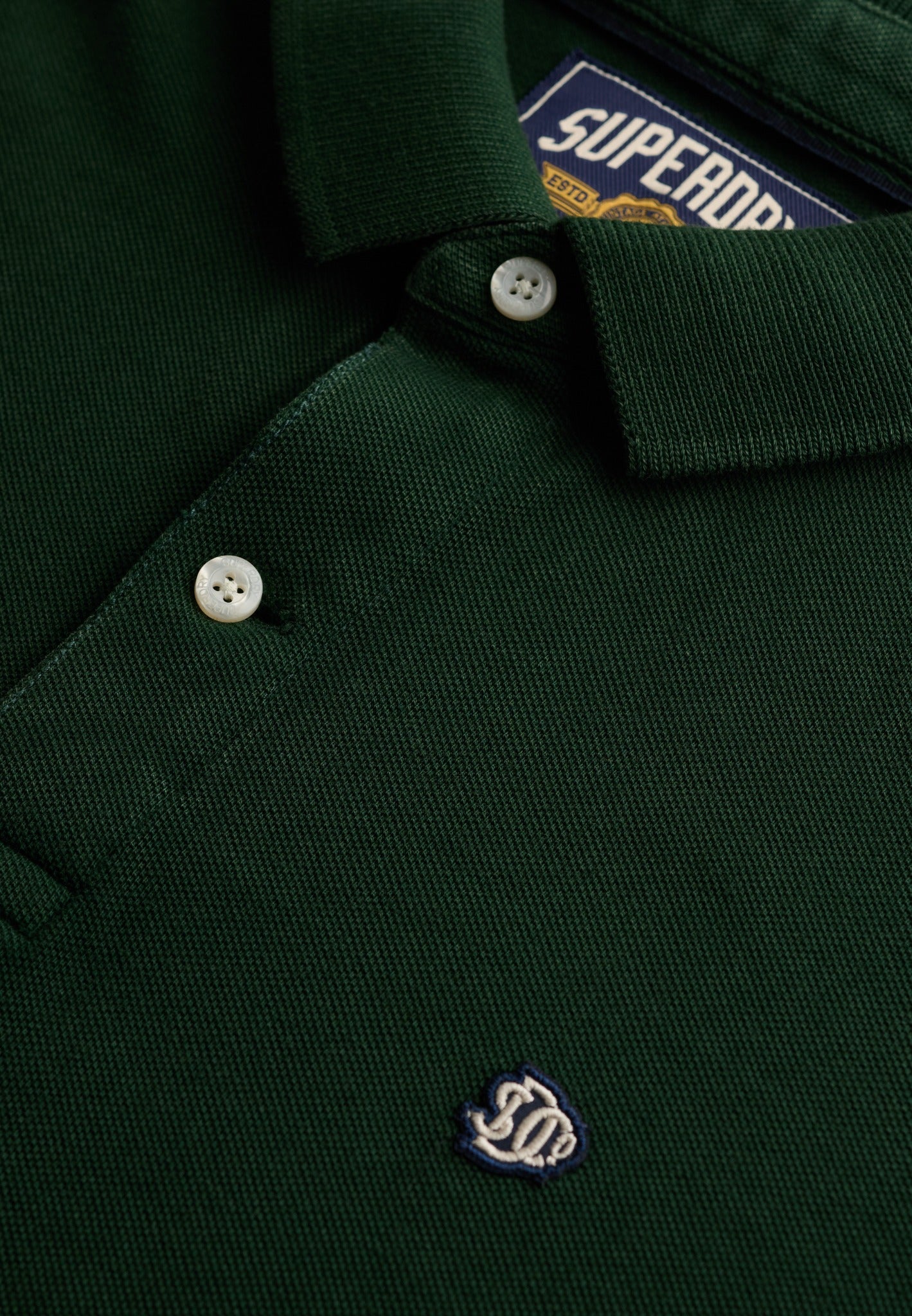 Superdry Vintage Destroy Polo in Mountain View button placket detail