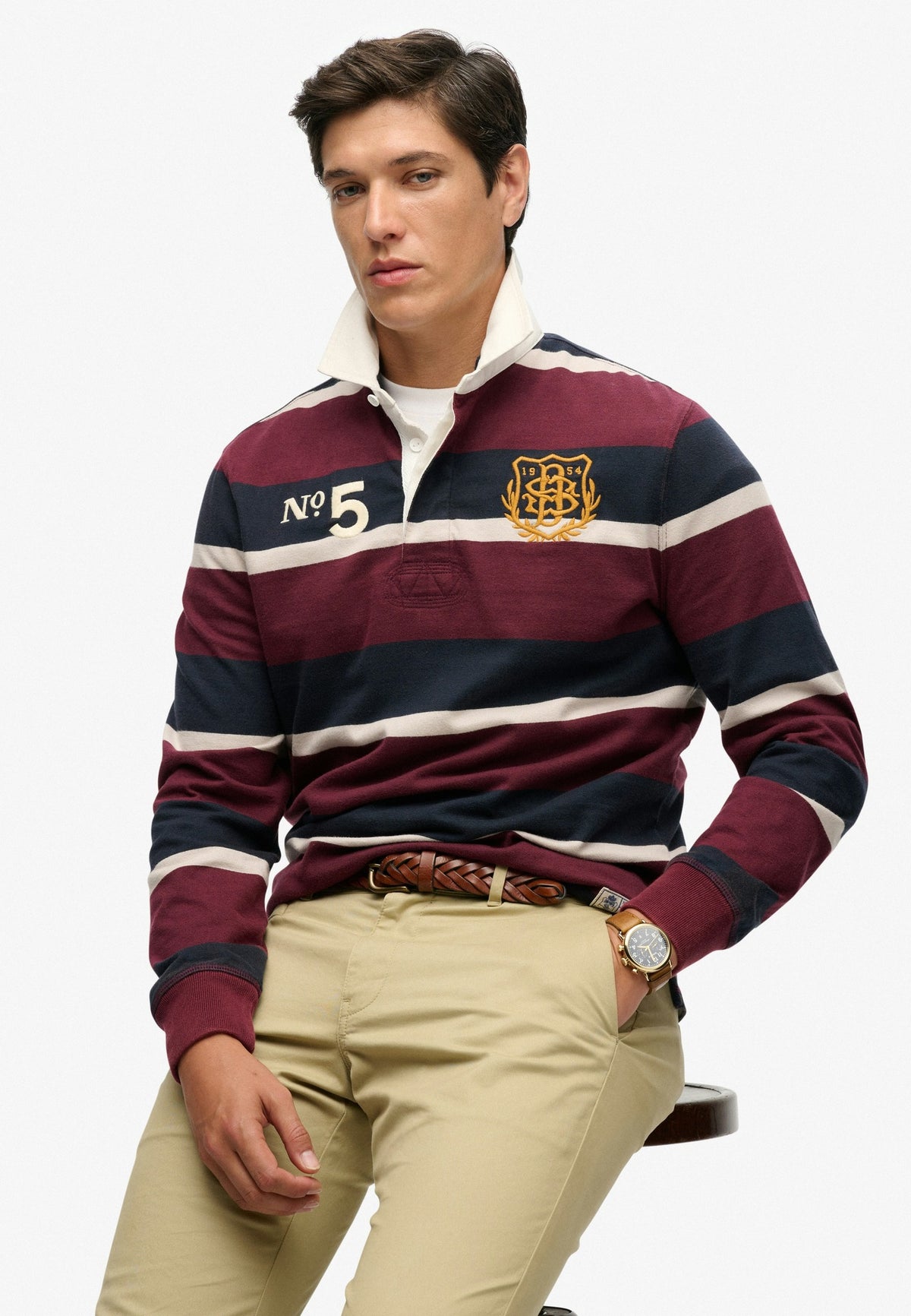 Superdry Double Emblem Stripe Rugby in Port/Navy Stripe seated view angled view