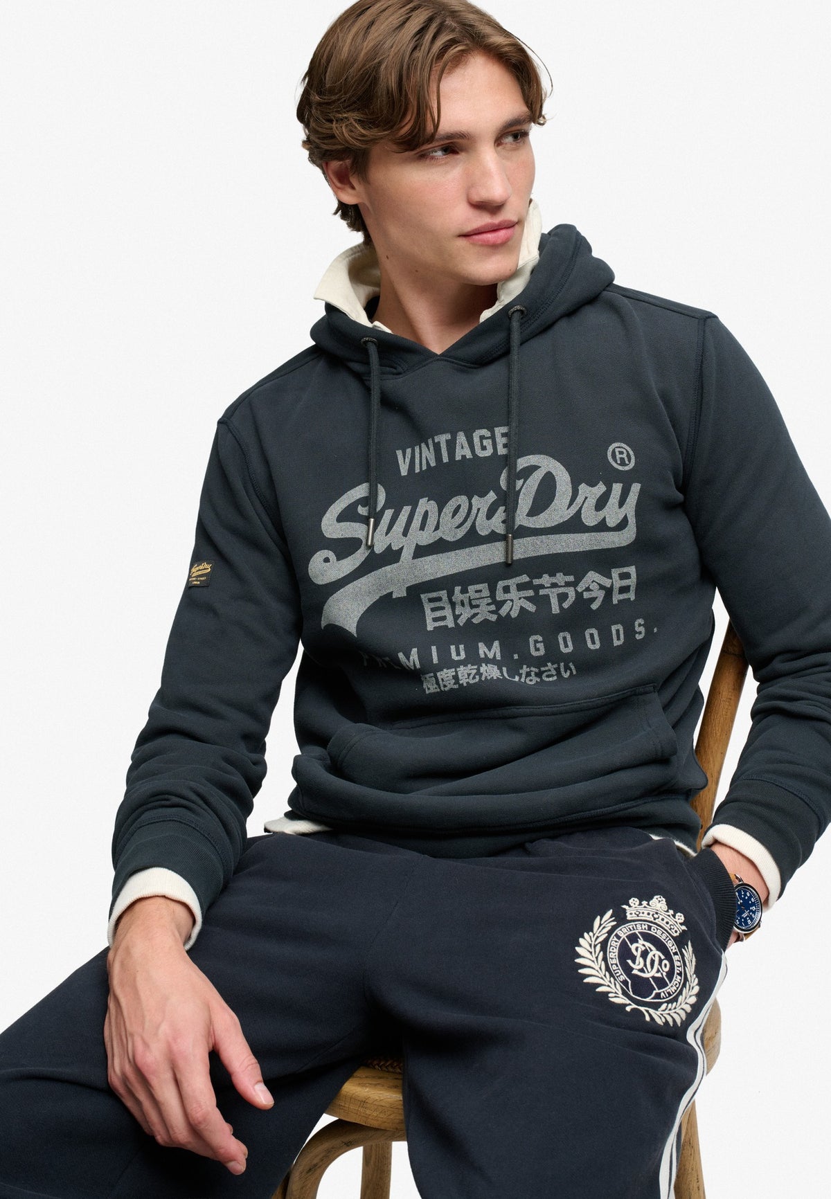 Superdry Vintage Logo Classic Hoodie in Eclipse Navy seated model view