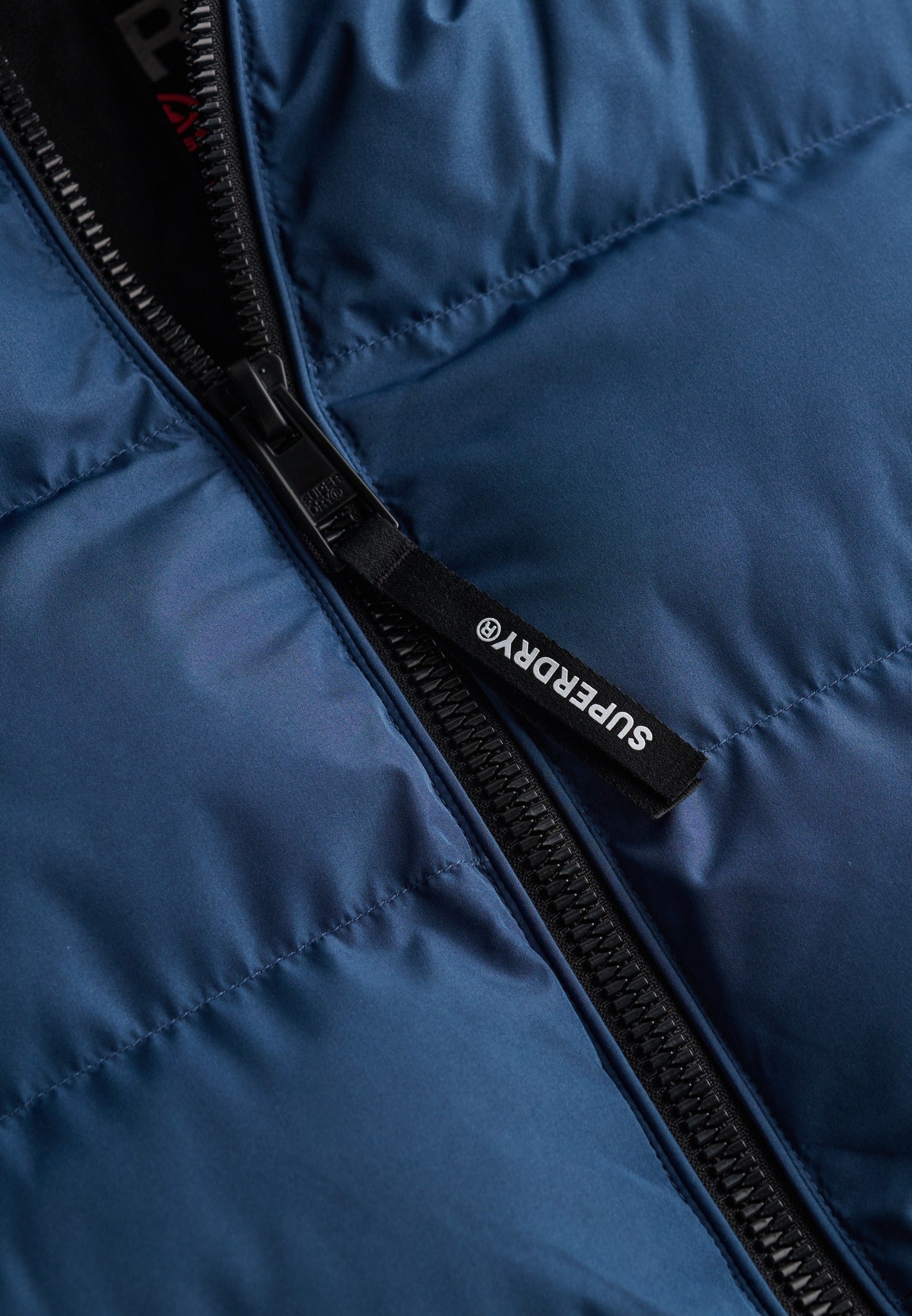 Superdry Hooded Sports Puffer Jacket in Altitude Blue zip detail