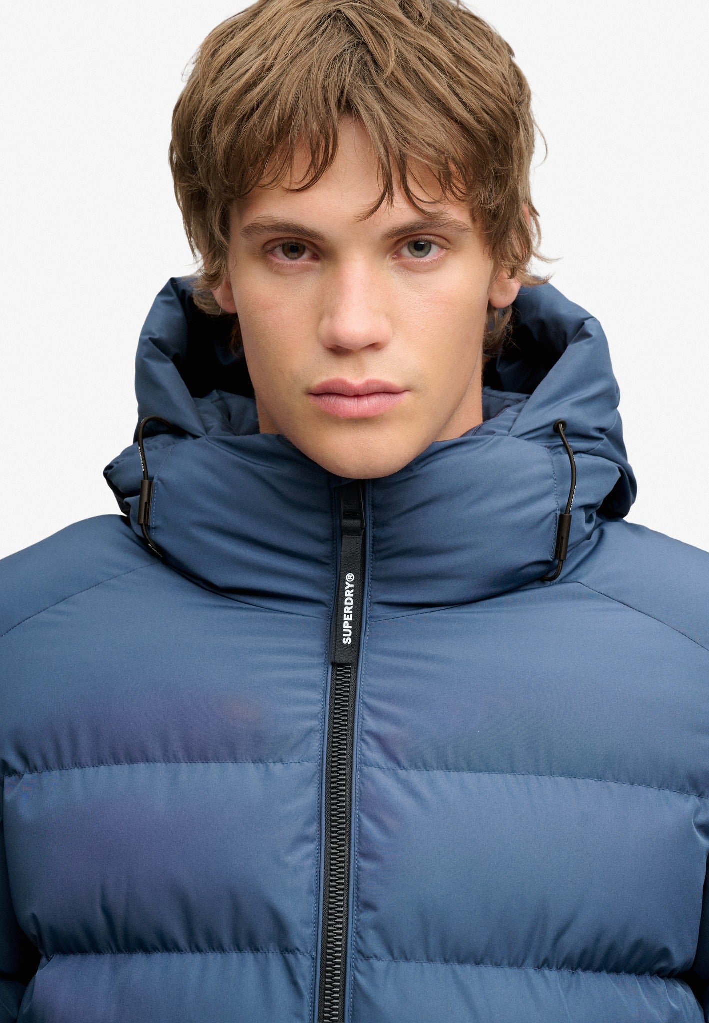 Superdry Hooded Sports Puffer Jacket in Altitude Blue hood and zip detail