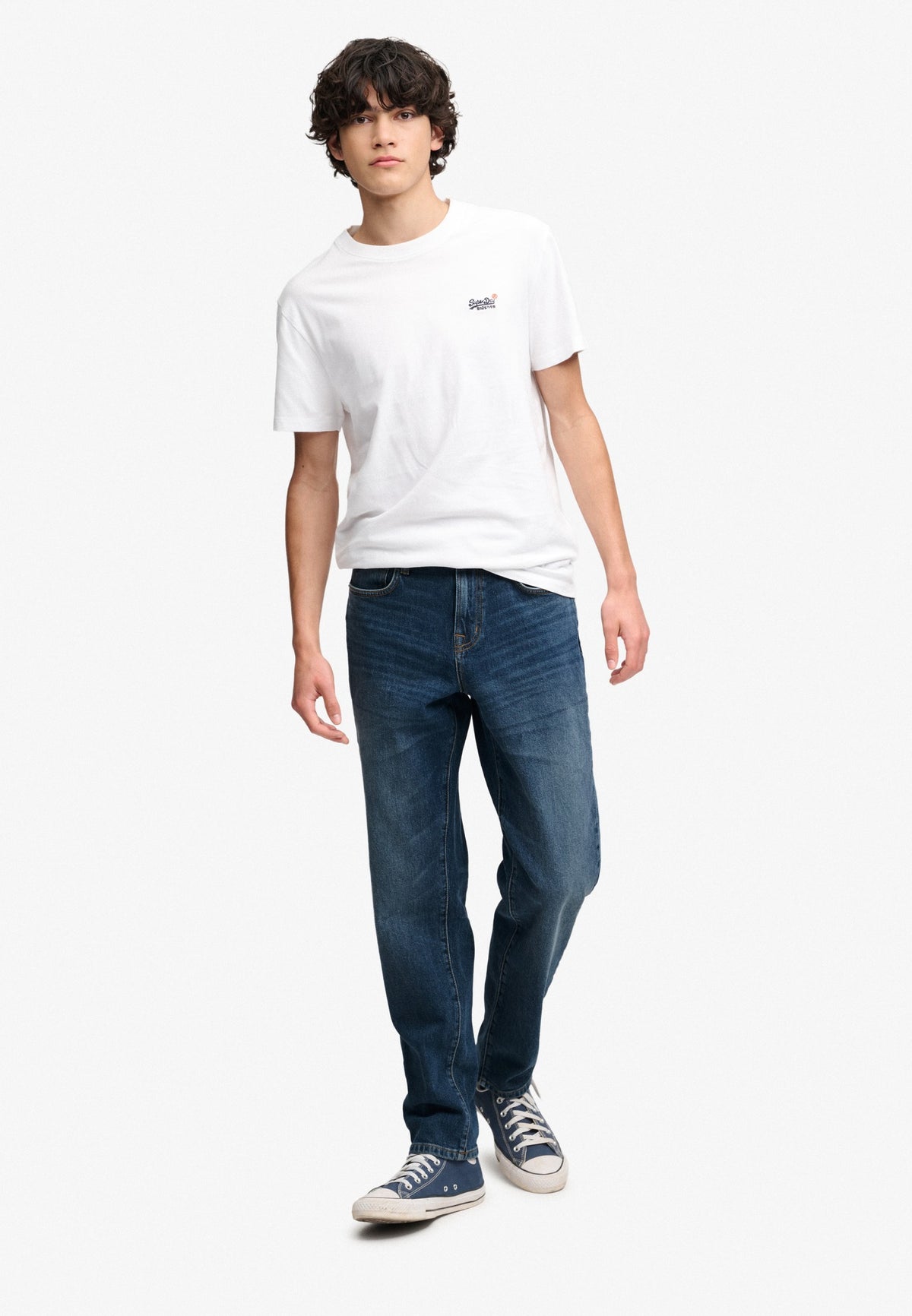 Superdry Vintage Tapered Jeans in Ranch Vintage Indigo angled view on model