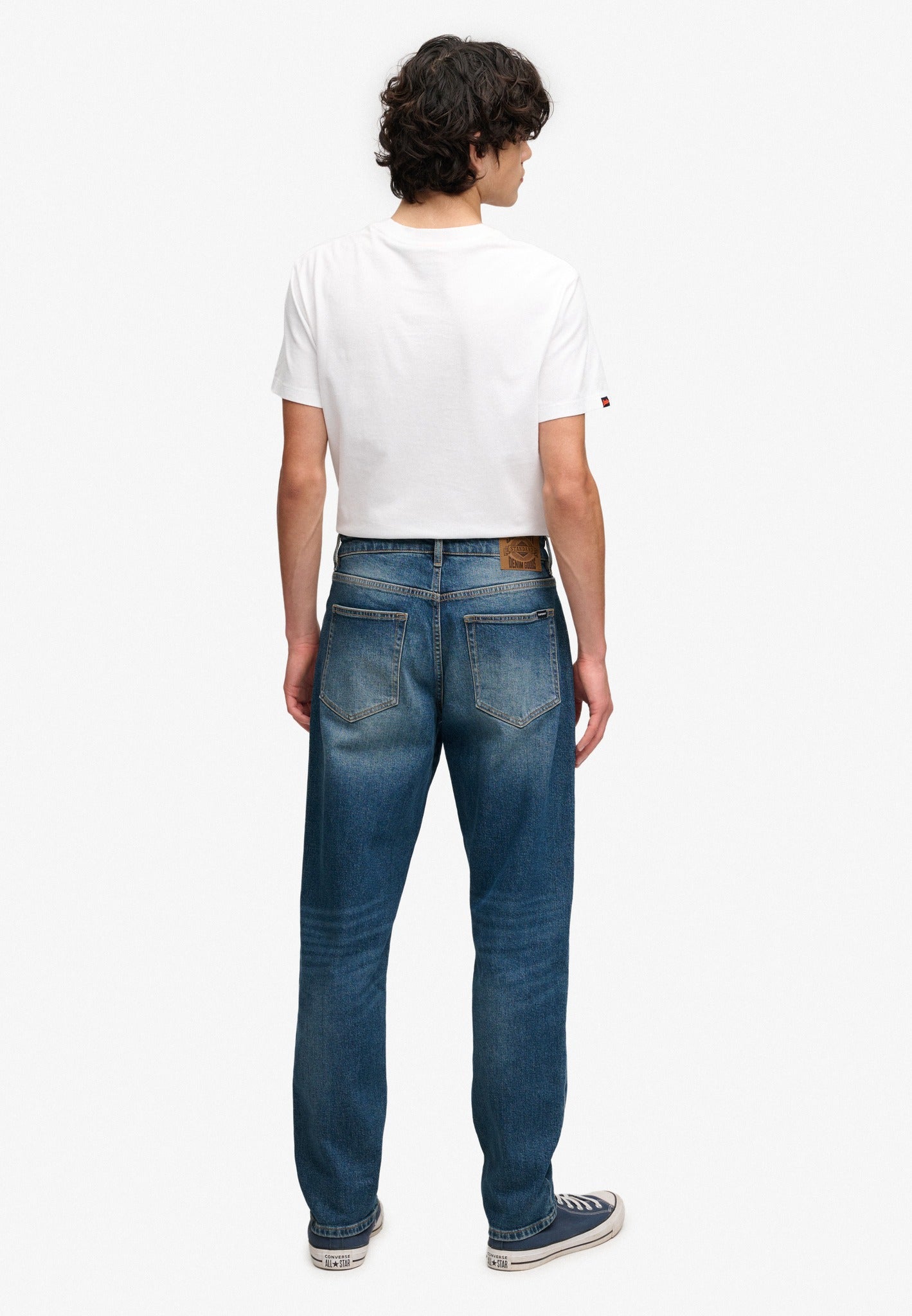 Superdry Vintage Tapered Jeans in Buck Blue angled model view