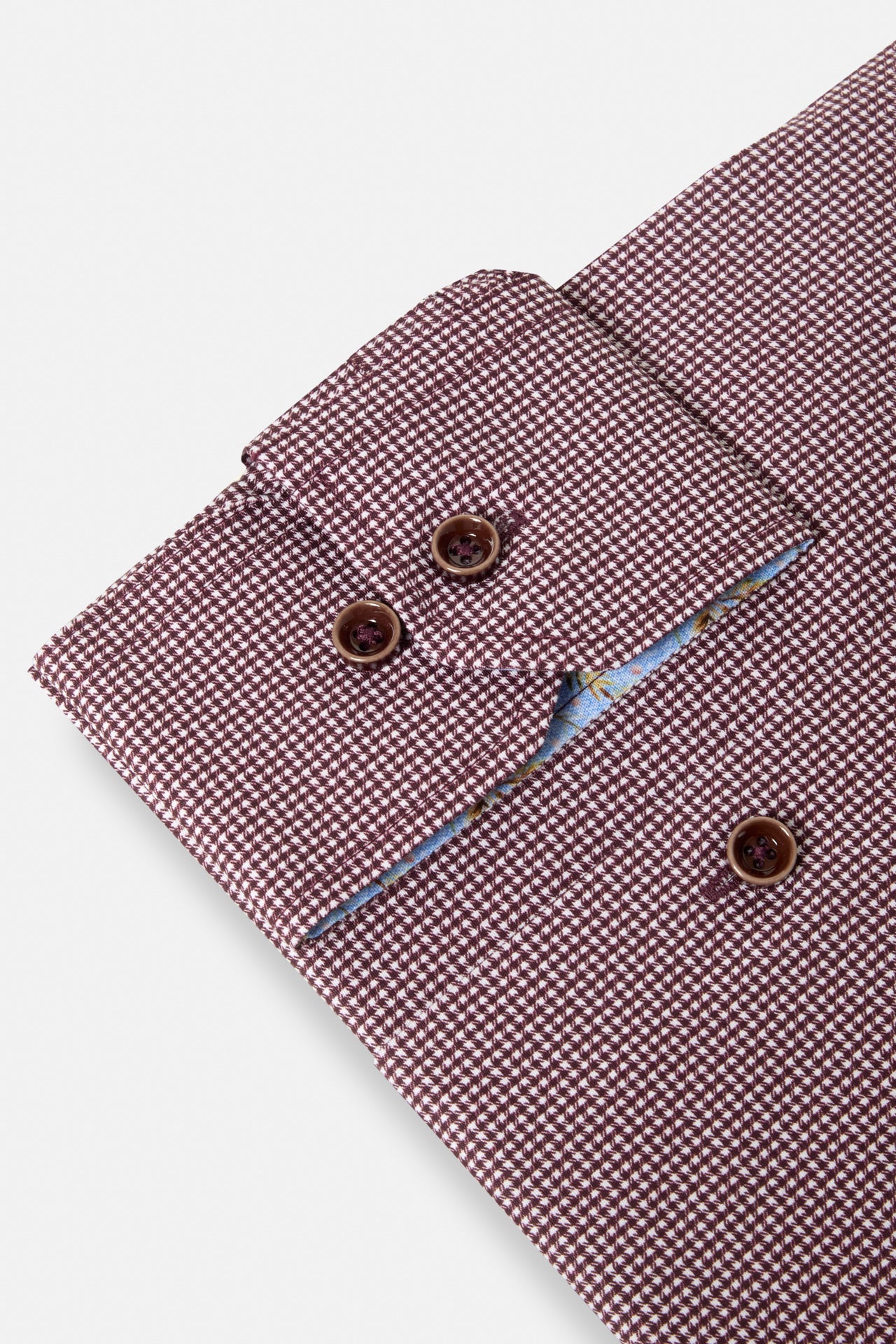Benetti Riga Long Sleeve Plum Shirt cuff close-up with patterned plum fabric and brown buttons