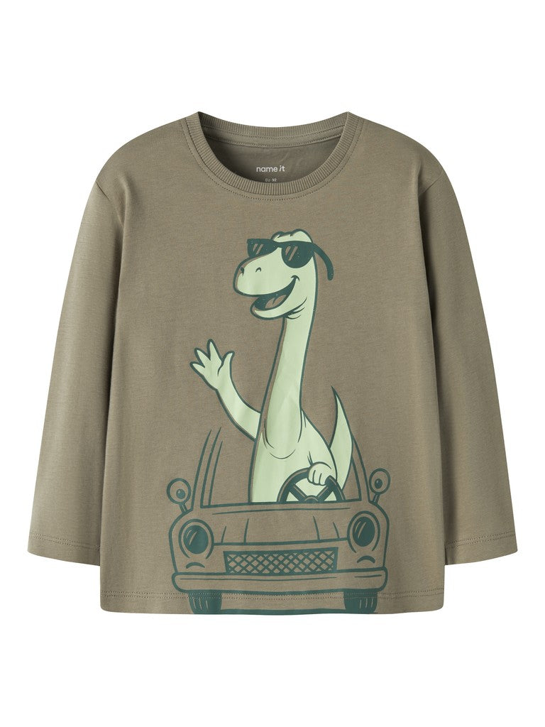 A long-sleeve crewneck t-shirt in a muted olive-brown color, featuring a cartoon graphic of a green dinosaur wearing sunglasses and driving a car.
