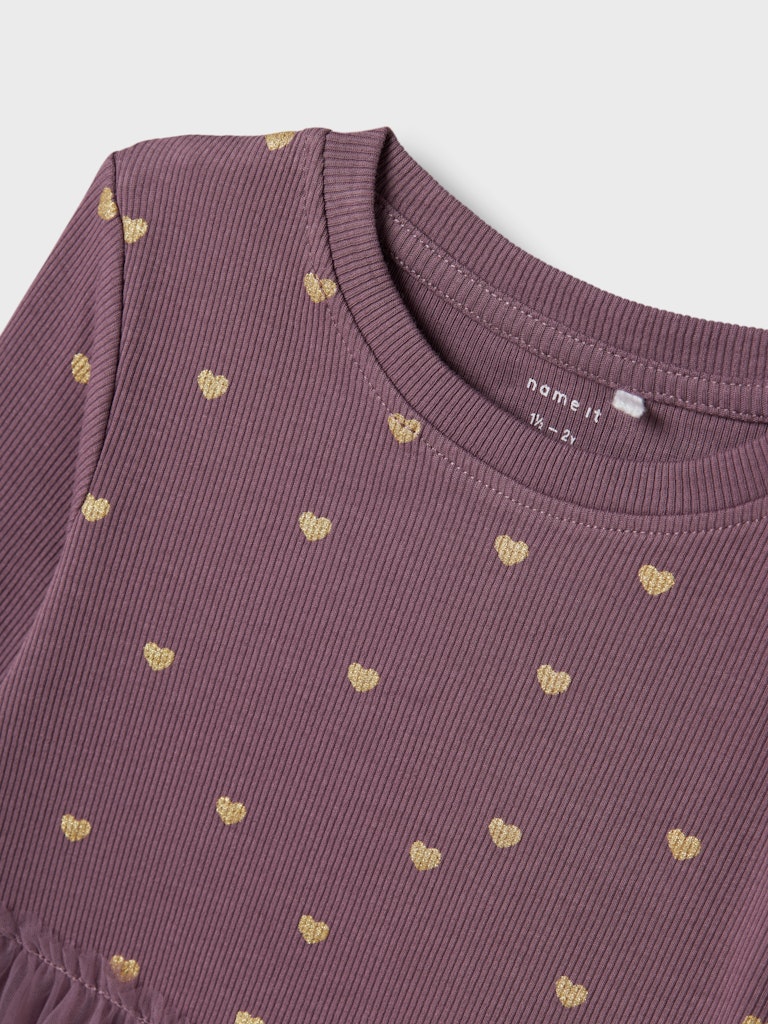 Purple dress with gold heart patterns on a white background