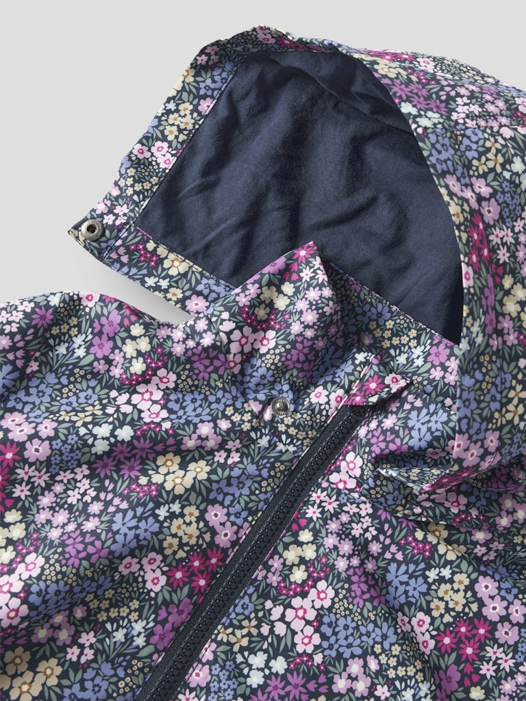 Floral patterned jacket with a close-up of the hood and zipper.