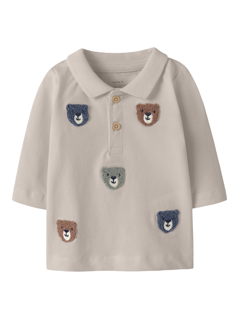 Beige polo shirt with embroidered bear faces on a white background