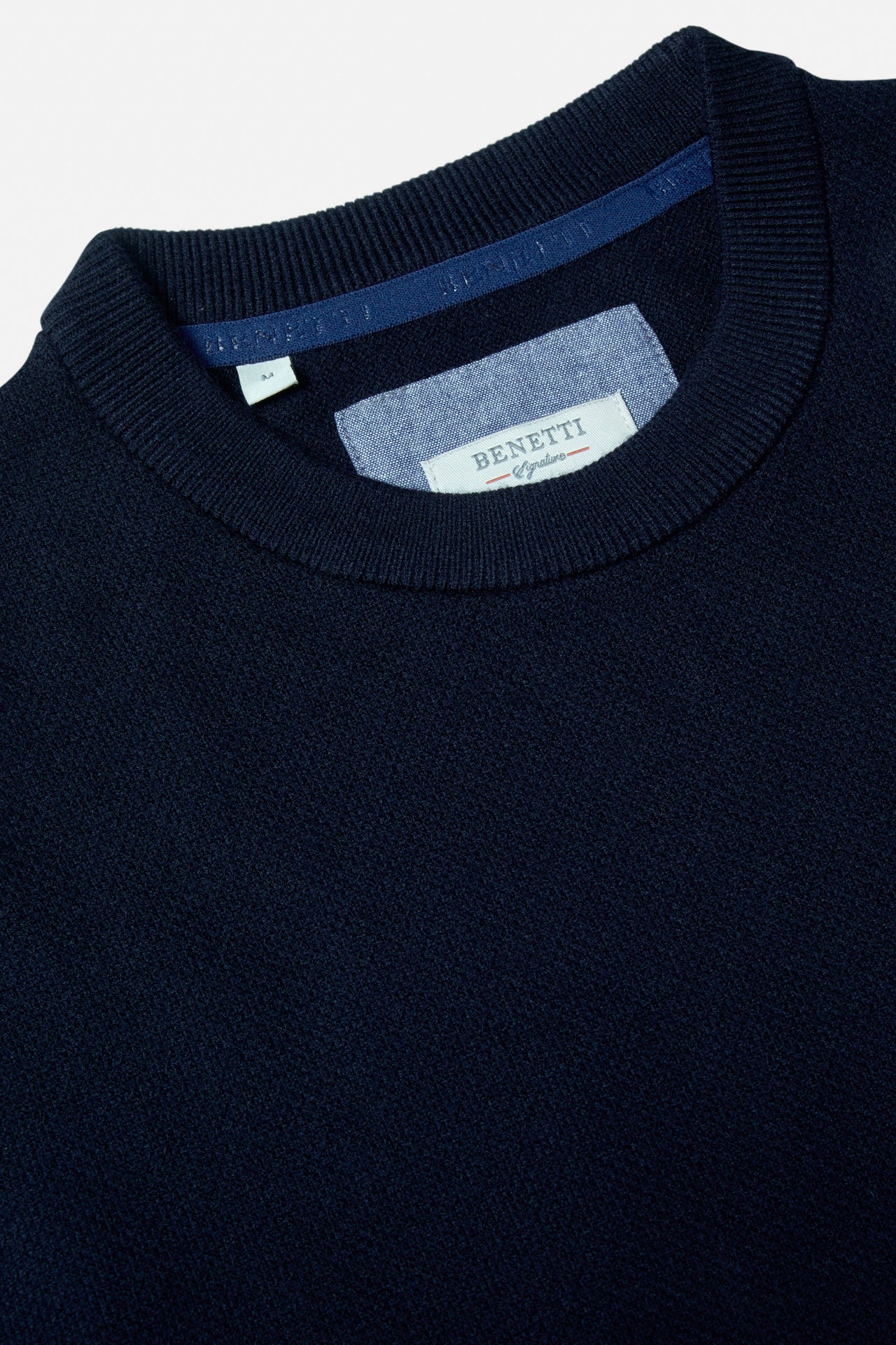 Benetti Quinn Navy O Neck Knit close-up of the ribbed crew neckline and inner labels