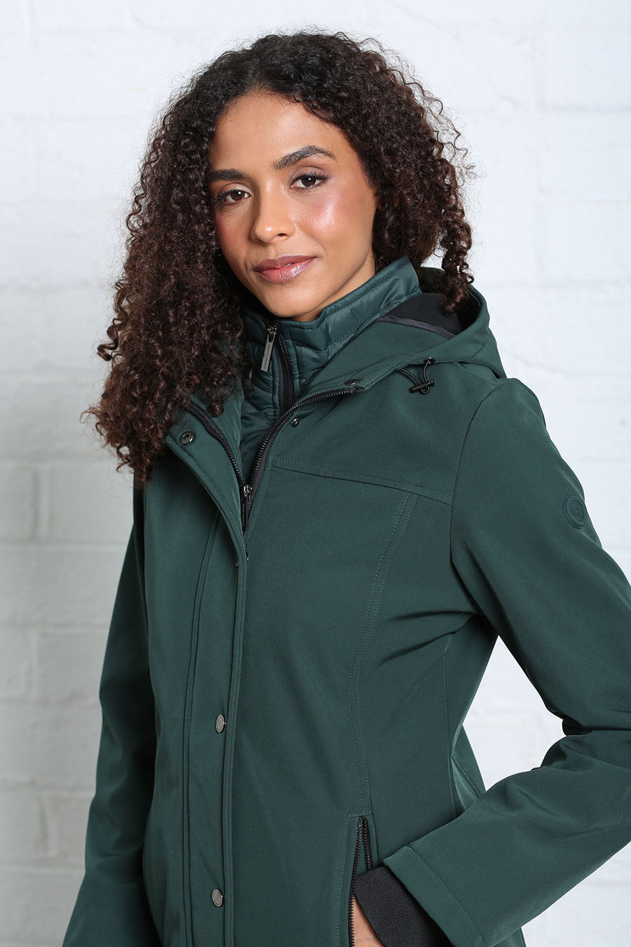Rant & Rave Relax & Renew Elsie coat in forest, angled front model view with hood and zip front.