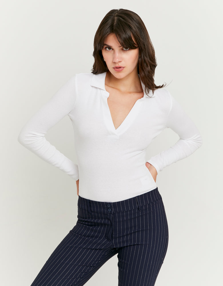 Model front view of women's white V neck bodysuit