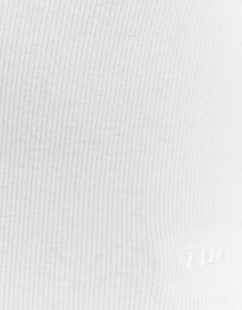 Detail view of white V neck bodysuit fabric