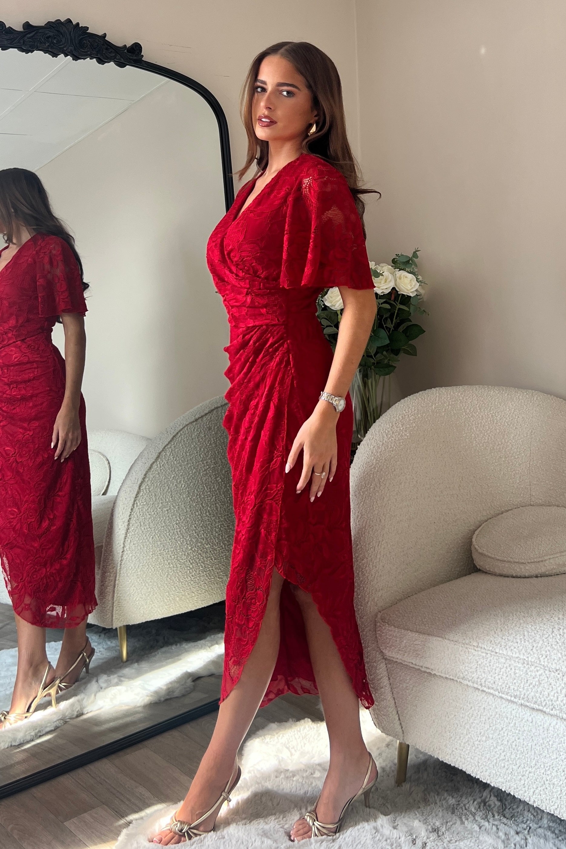 Side view of Natasha red lace midi dress with angel sleeves