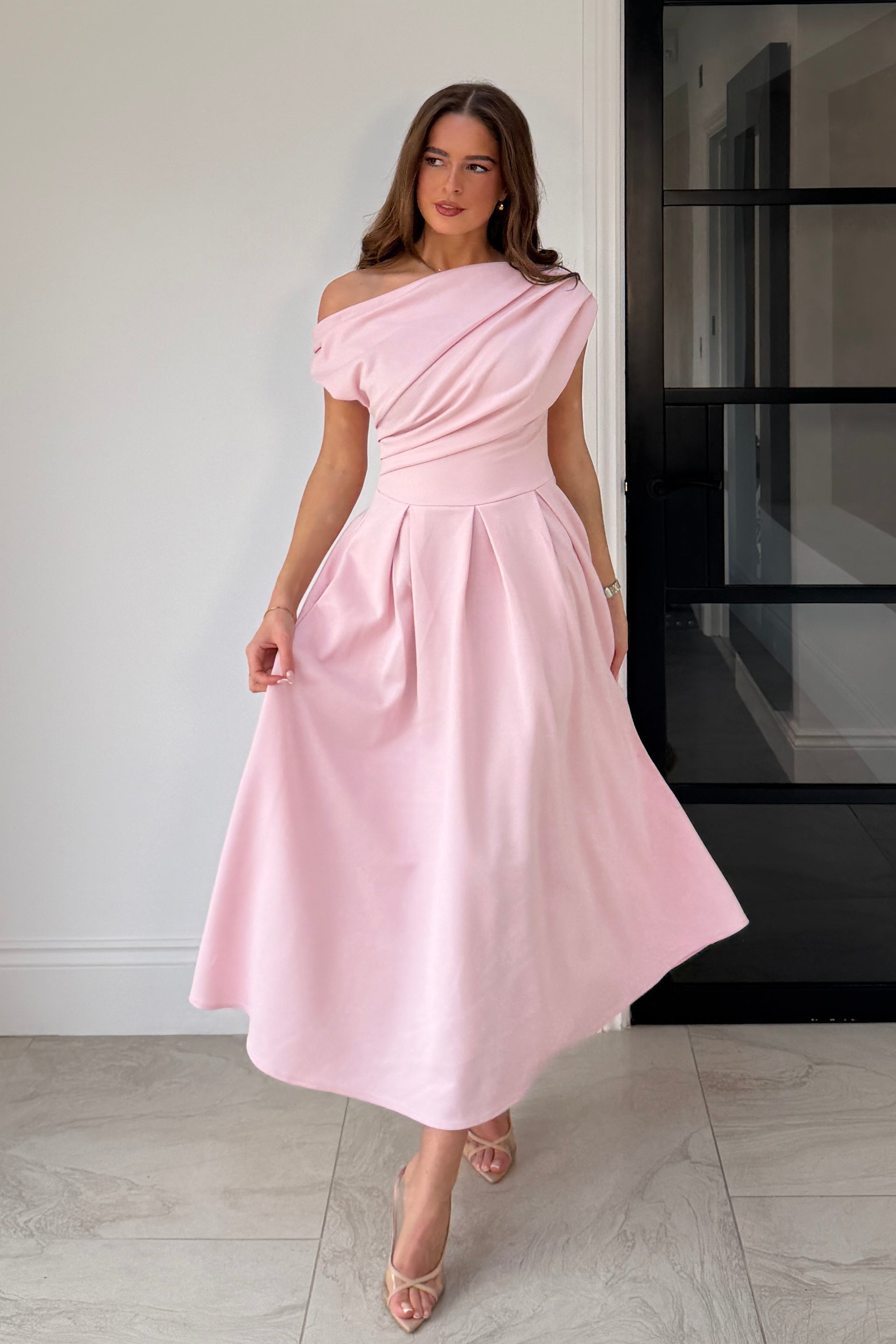 Front view of Betty pink skater midi dress with asymmetric neckline