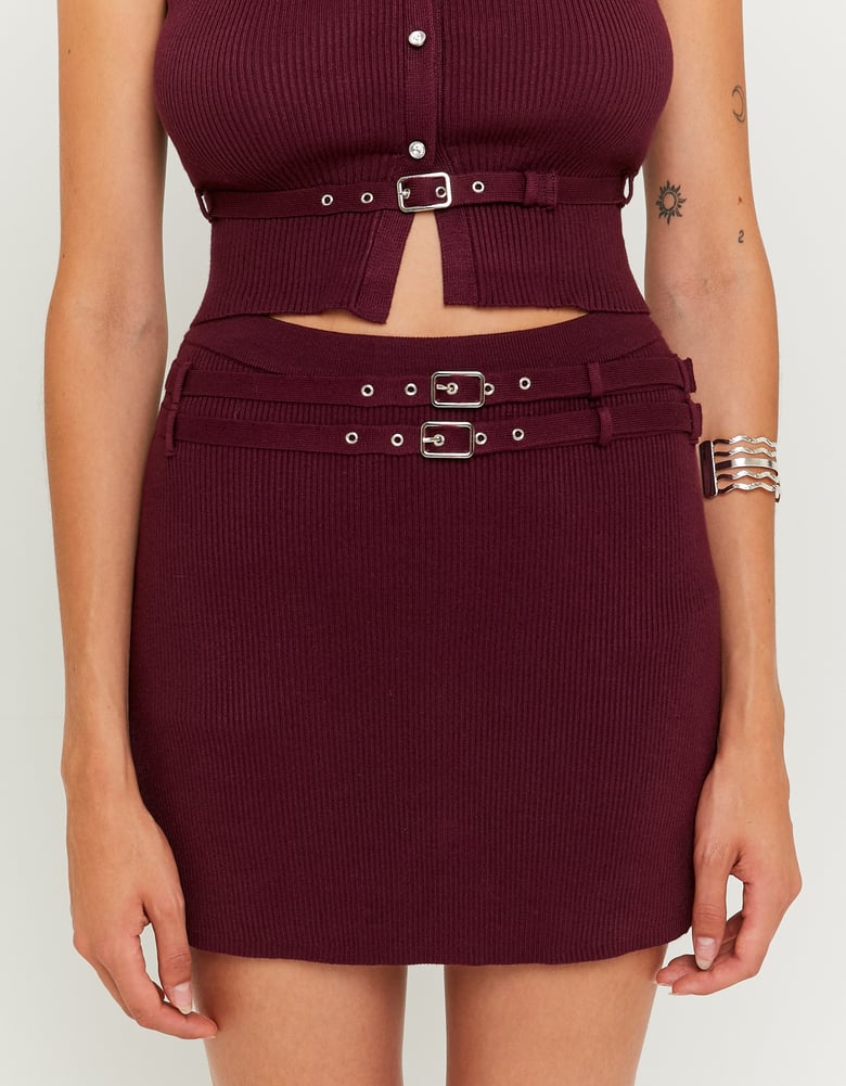 Maroon ribbed top and skirt set with belt details on a white background