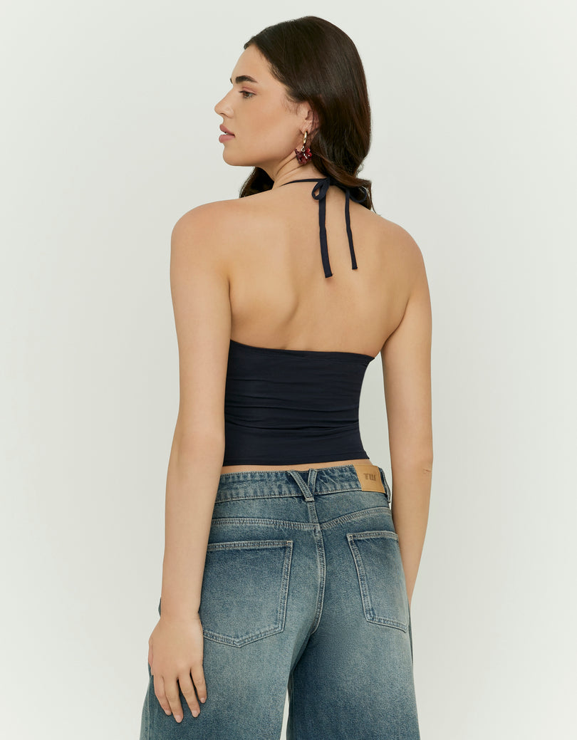 Woman wearing a black halter top - Back view