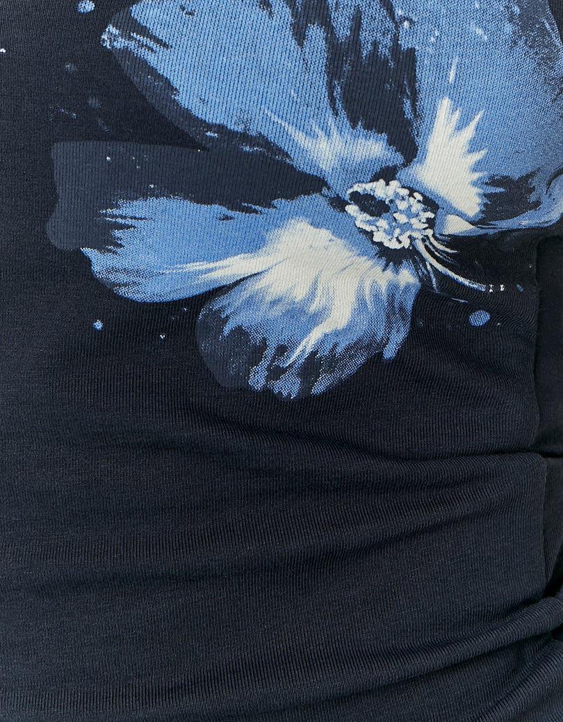 Close-up of a black garment with a blue floral design-Close View of Design