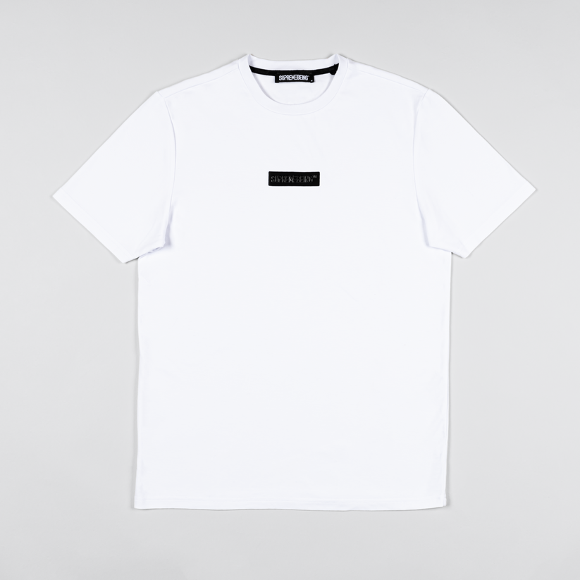 White t-shirt with a small black logo on a light gray background