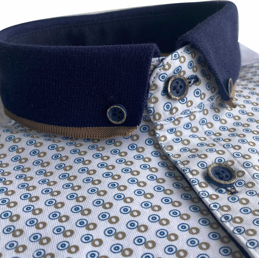 Close-up of Tom Penn white polo shirt with blue and taupe micro print, navy button-down collar and button placket