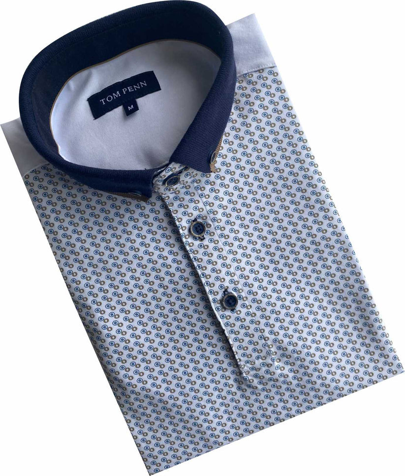 Angled folded view of Tom Penn men’s white patterned polo shirt with navy contrast collar