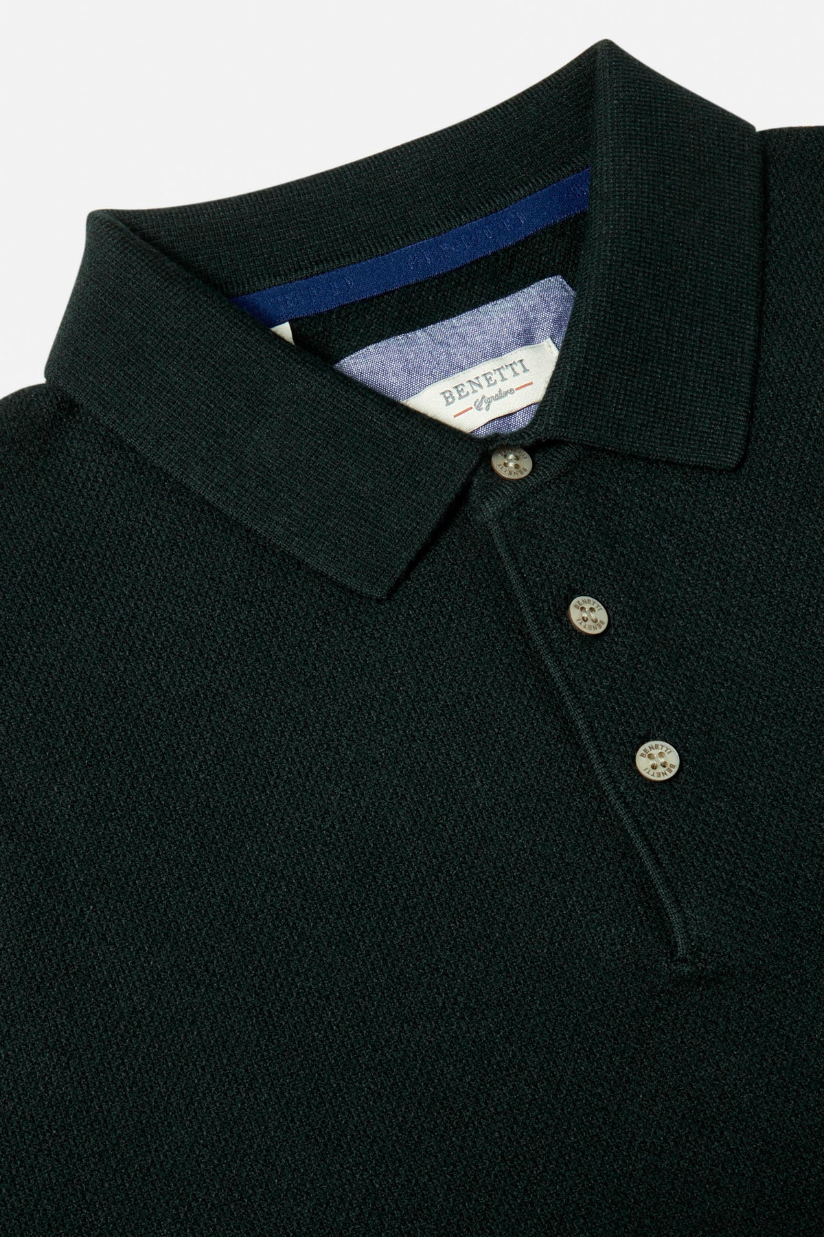 Close-up of a Benetti Trevor Forest knit polo with collared neckline and three-button placket.