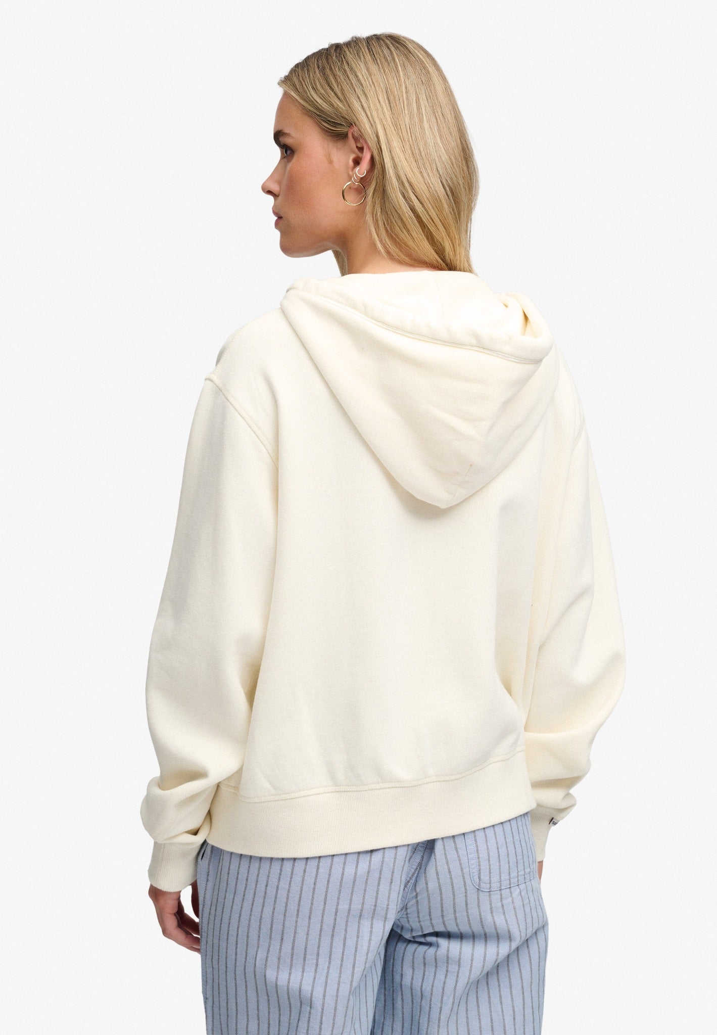 Superdry Ath Essential Relaxed Crop Ziphood in Desert Bone Off White back view on model
