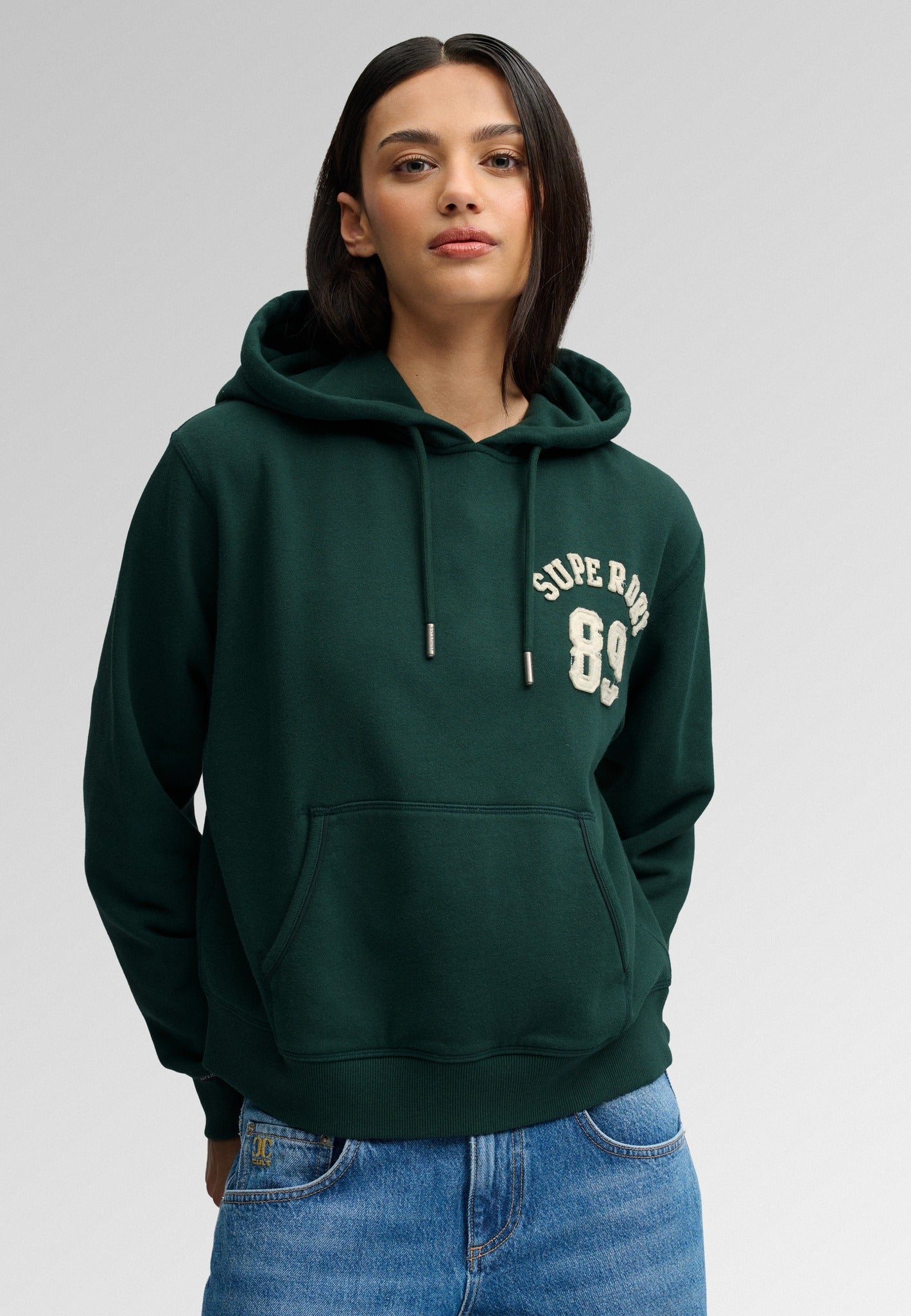 Superdry Ath Essential Applique Crop Hood in Enamel Green on model