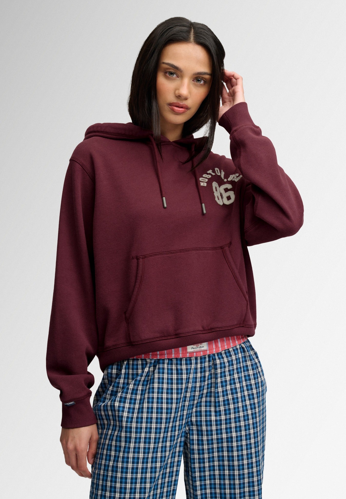 Superdry Ath Essential Applique Crop Hood in Port Red on model