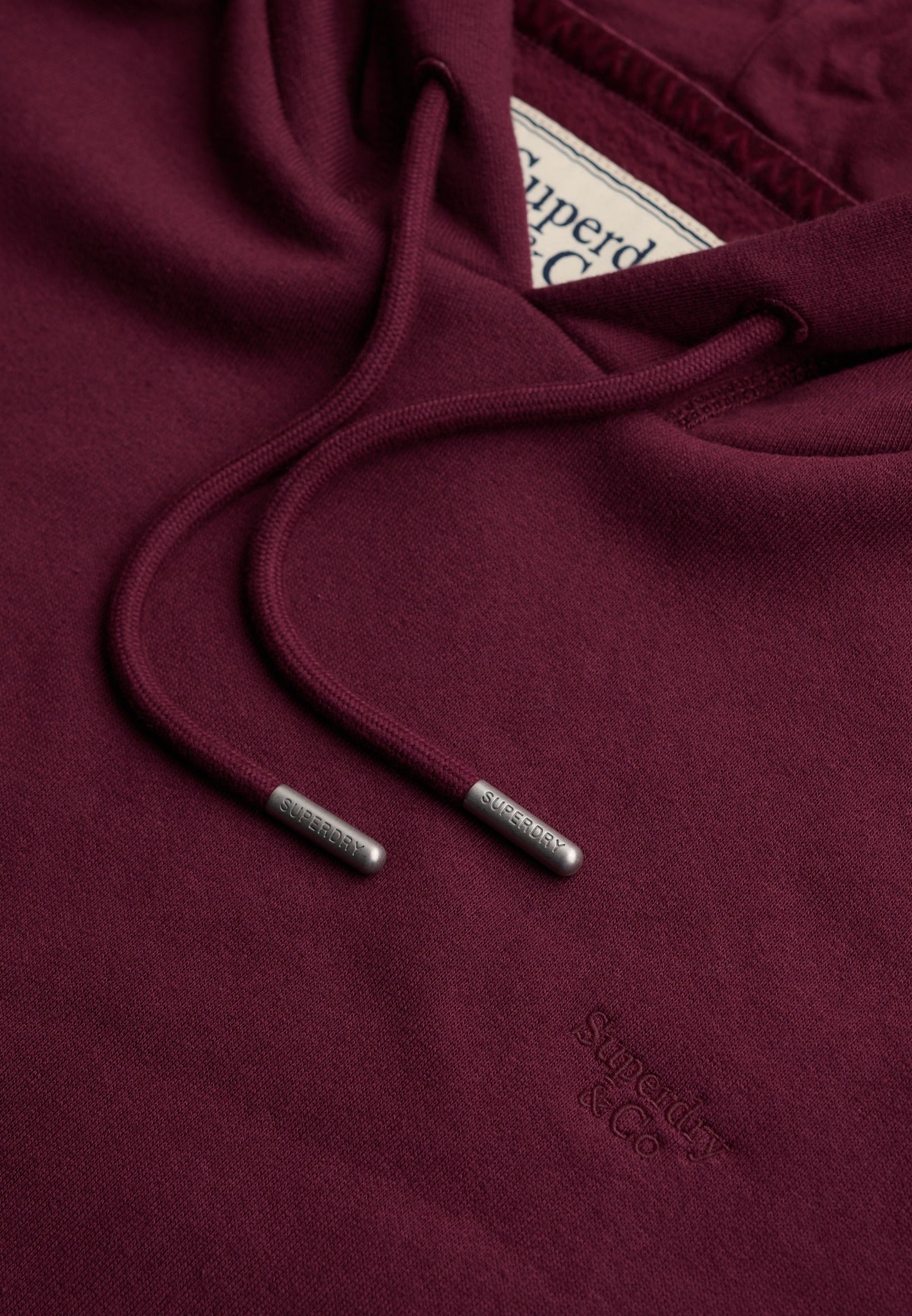 Superdry Signature Embroidered Hood in Port Red hood drawcord detail