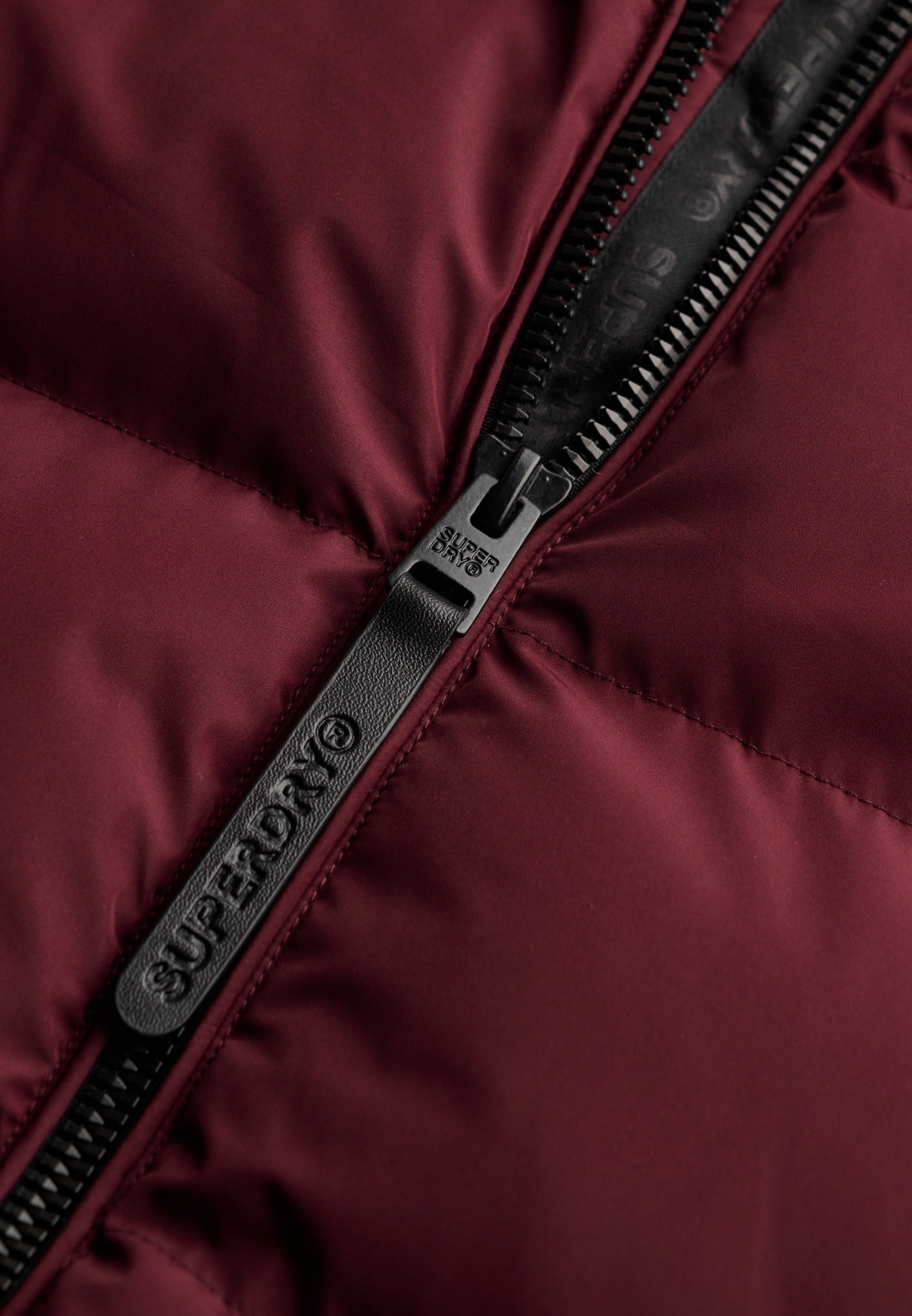 Superdry Hooded Sports Puffer Jacket in Port Red zip detail