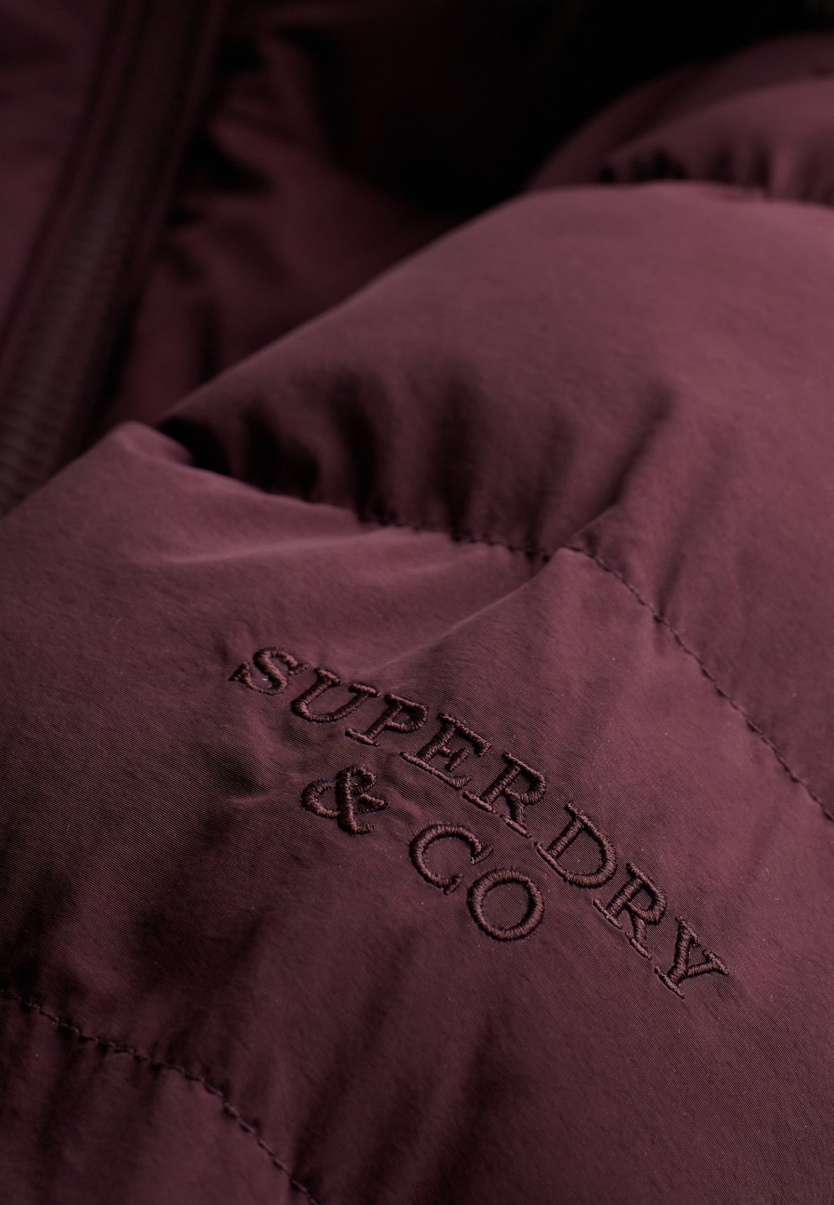 Superdry Hood Faux Fur Fuji Mid Length Jacket in Dark Oxblood embroidered logo detail